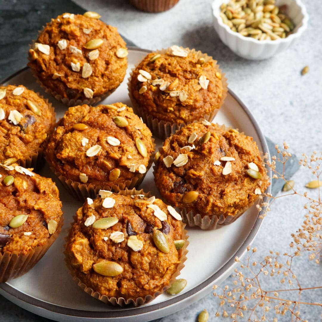 whole wheat pumpkin oatmeal muffins served in a white plate