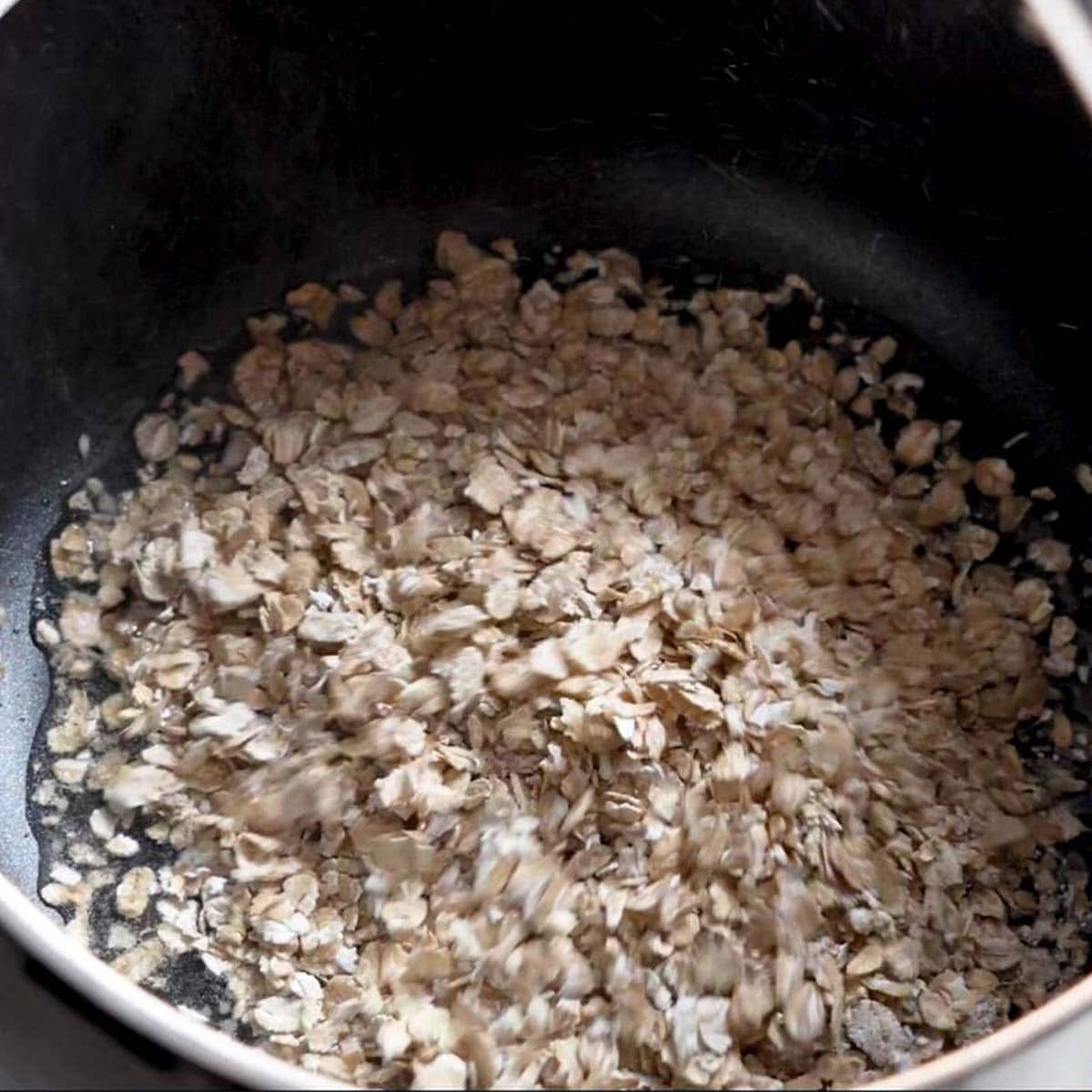 saute rolled oats in a pan