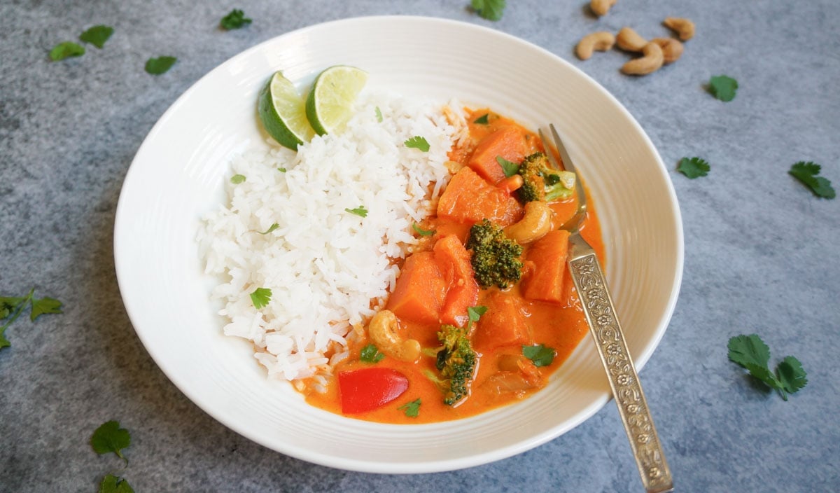 thai pumpkin red curry in a plate with rice