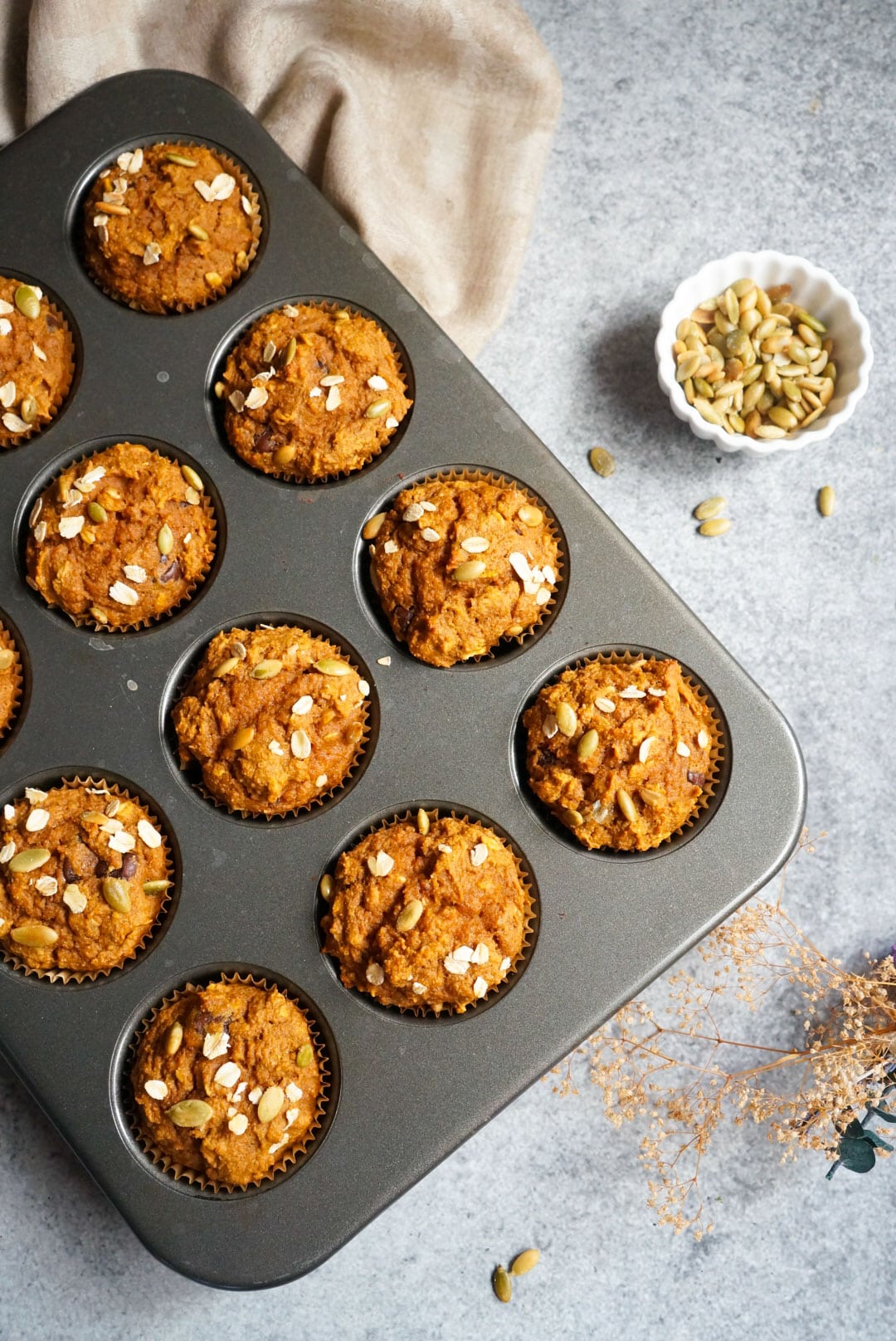 freshly baked Pumpkin Oatmeal Muffins in a muffin molder