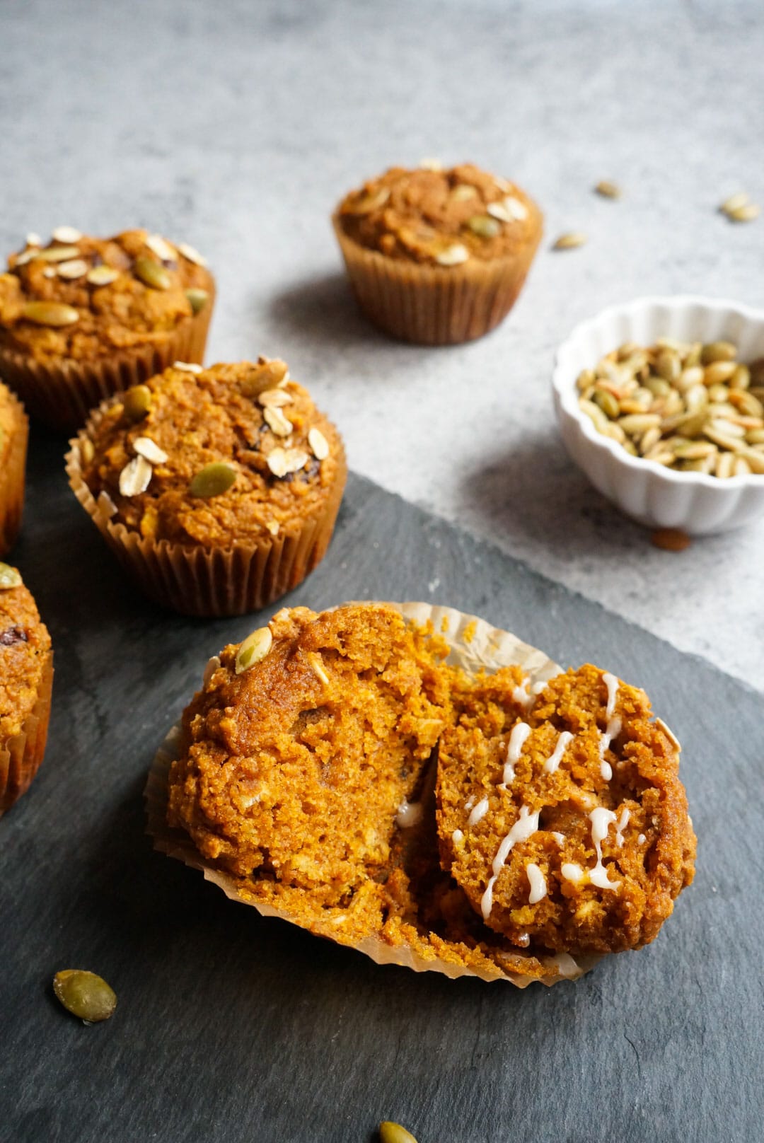 close up shot of Pumpkin Oatmeal Muffins sliced in half