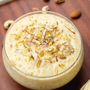 Sabudana kheer in a bowl garnished with nuts and saffron