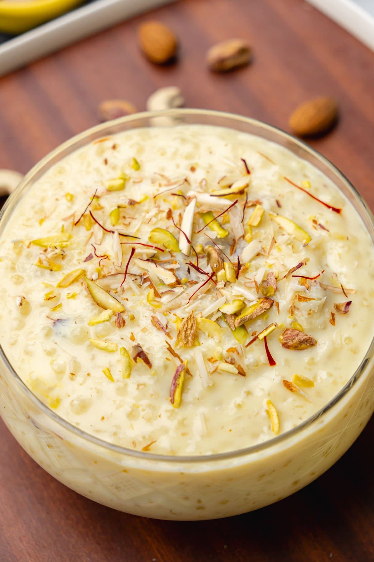 Sabudana kheer in a bowl garnished with nuts and saffron