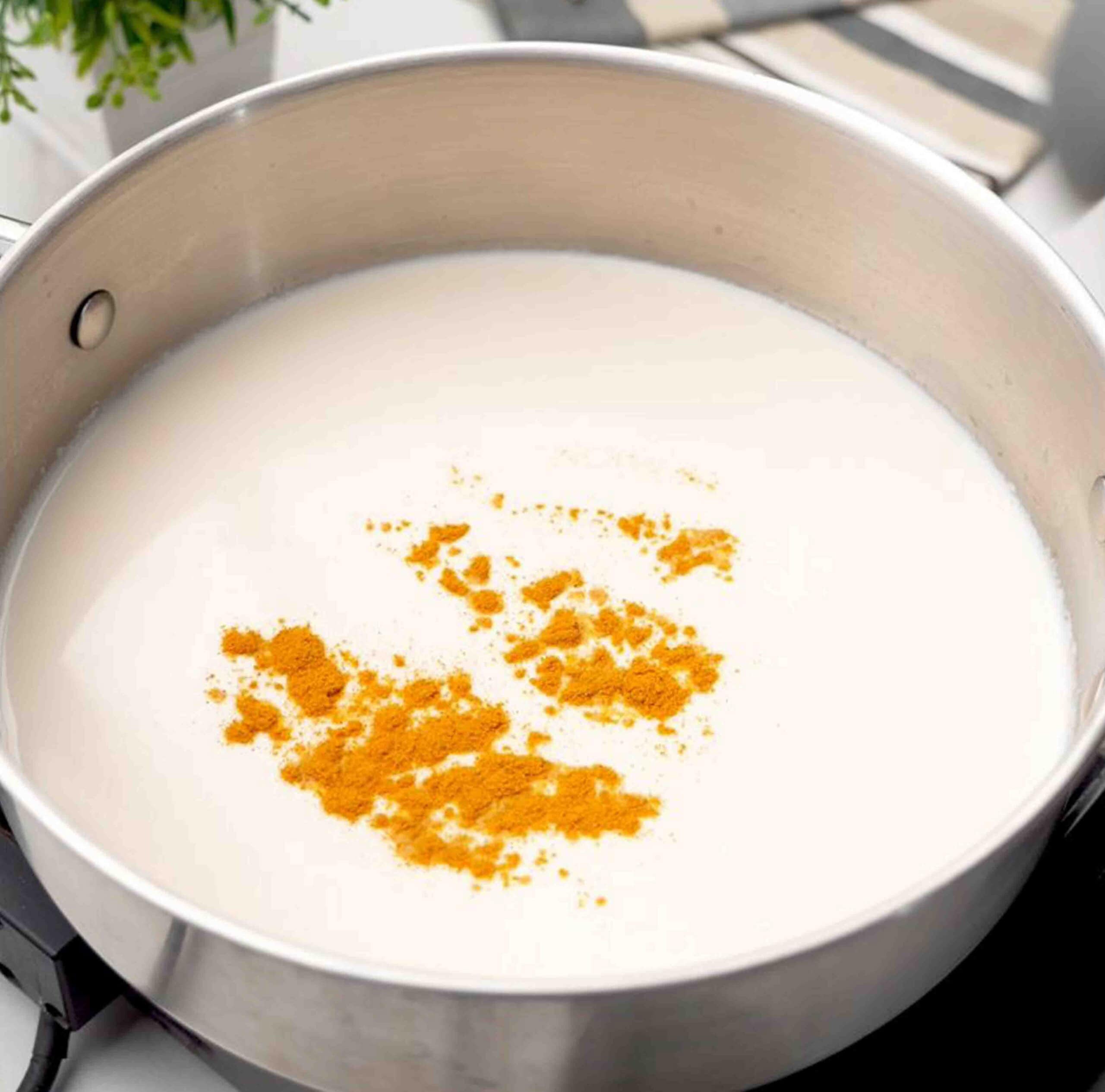 add turmeric powder into the pan to make haldi doodh
