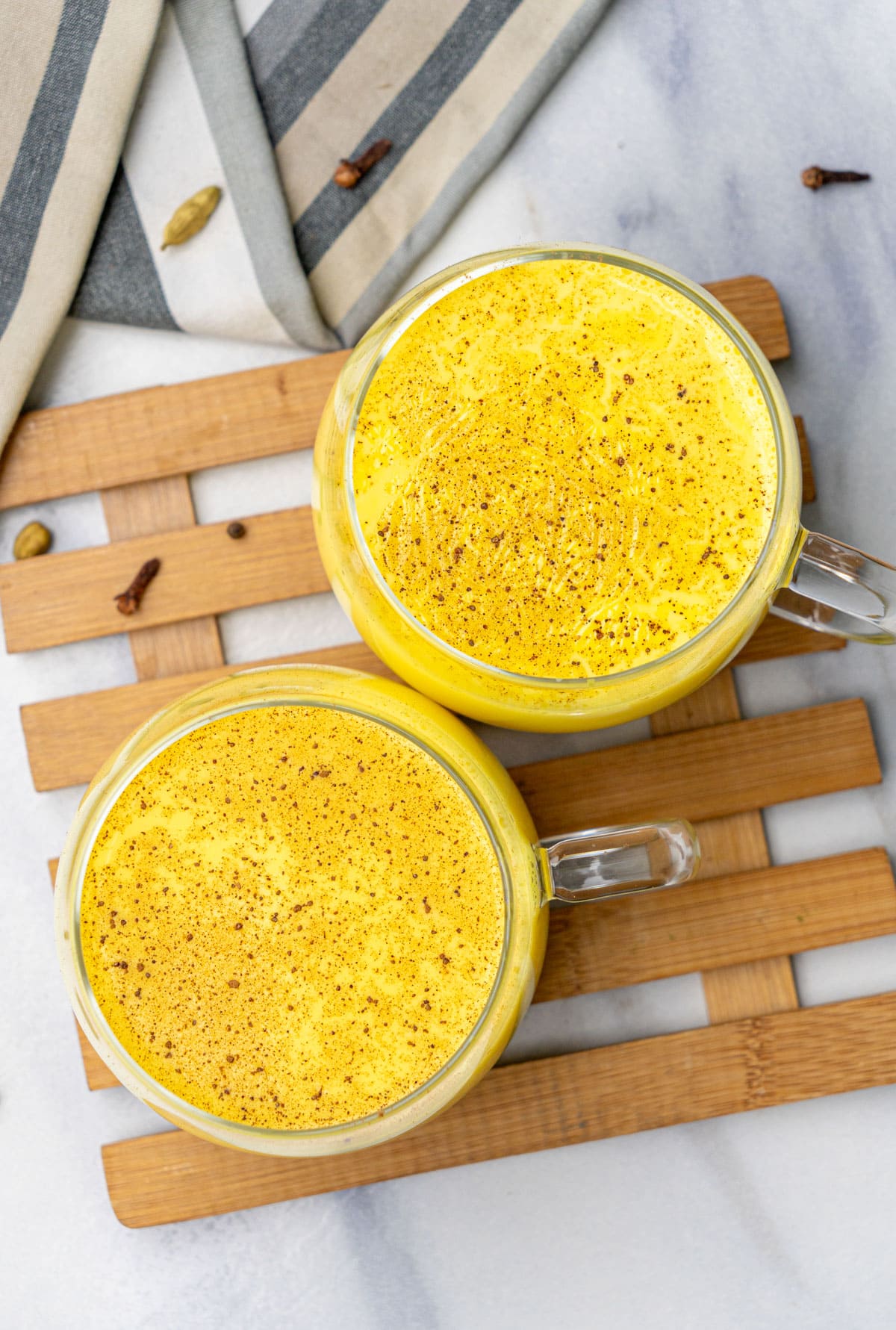 top view of haldi doodh in two cups