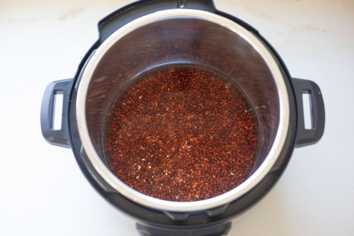 Adzuki beans ready to cook with water in the Instant Pot