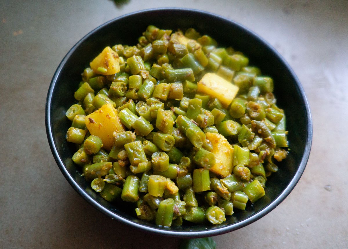 Instant pot aloo beans on a black bowl ready to serve