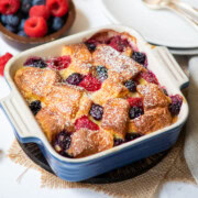 bread pudding with fresh berries in a square bowl