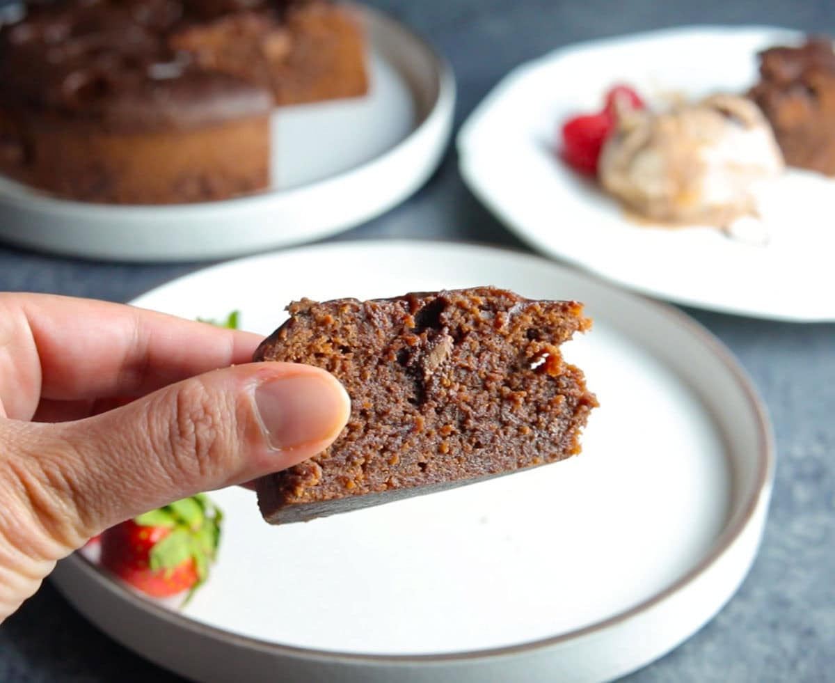 A slice of homemade brownie in hand