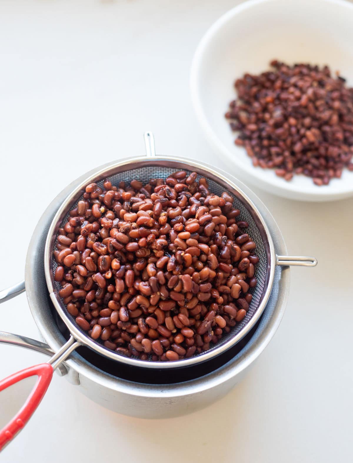 Straining the water after cooking adzuki beans in an Instant Pot