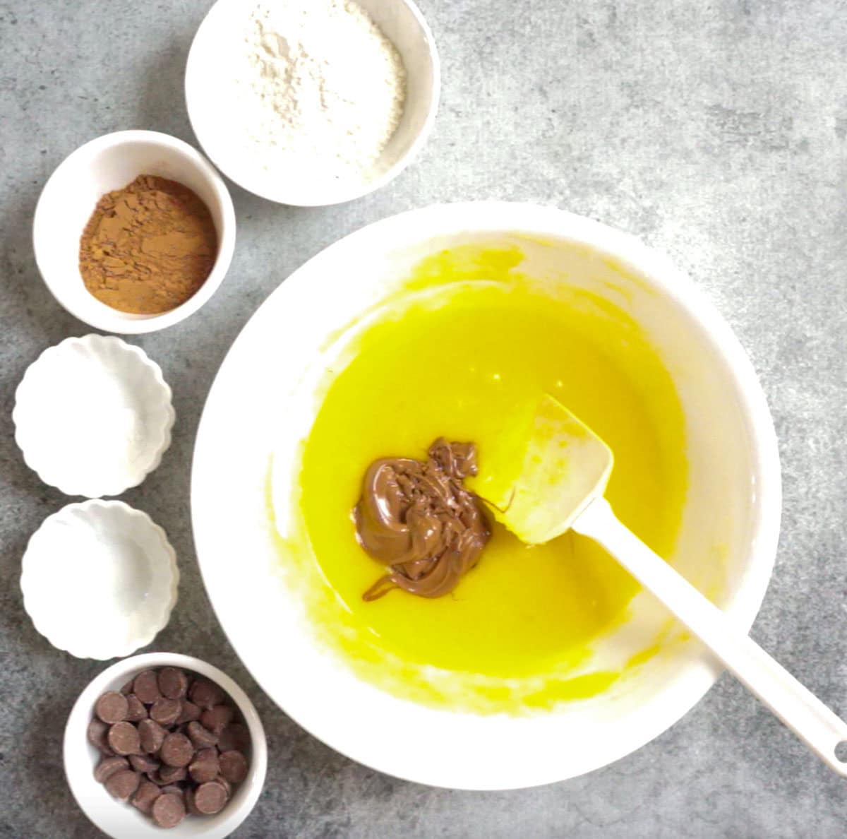 added melted chocolate into the bowl with melted butter