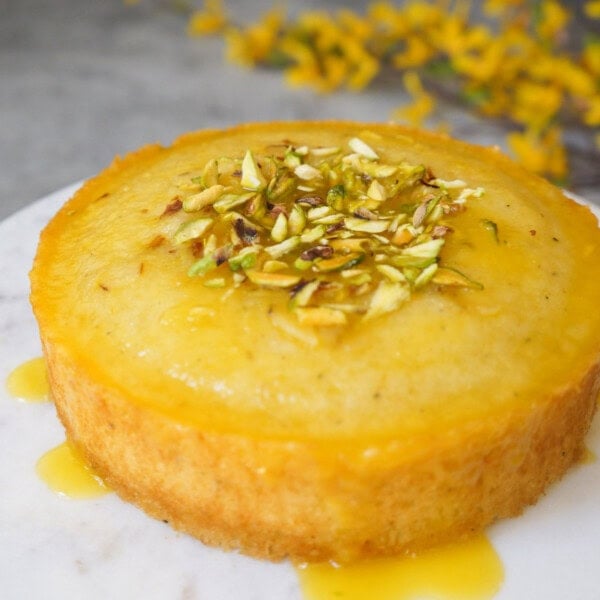 close up shot of whole semolina cake in a cake stand