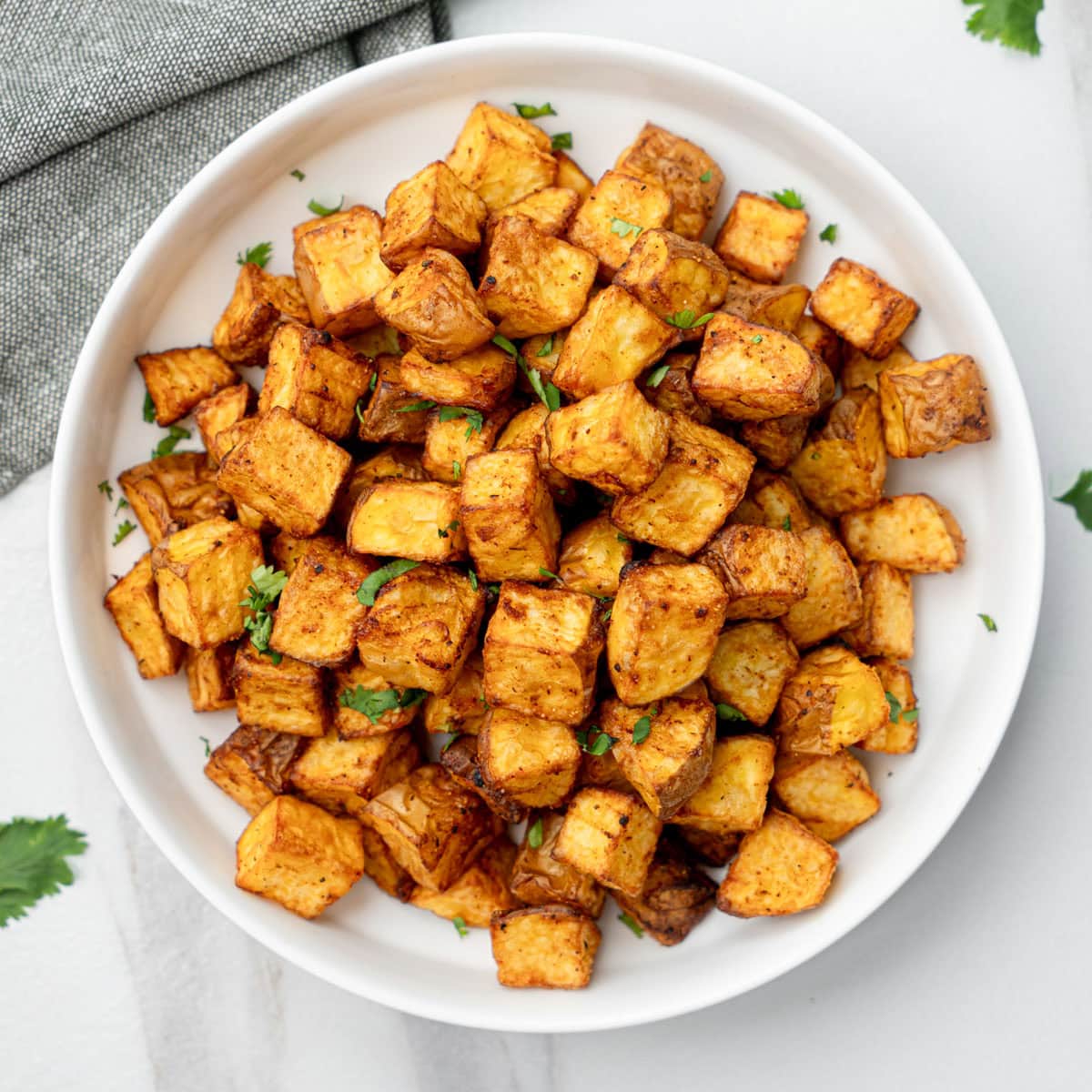 ready to serve air fried diced potato in a bowl