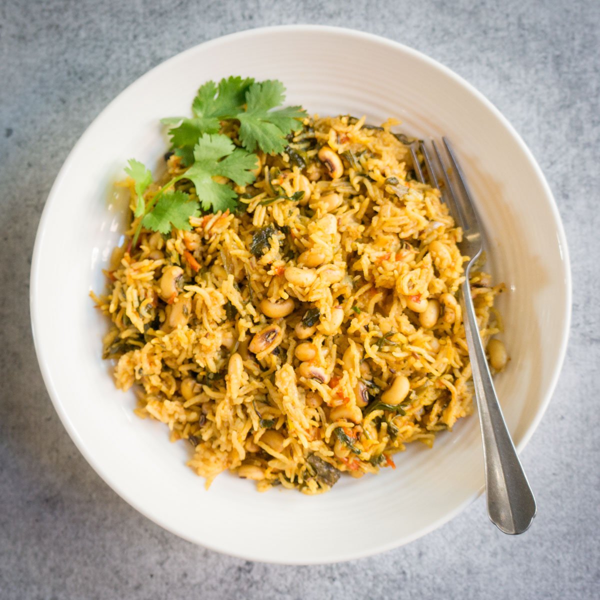 ready to serve black eyed peas pulao in a white plate