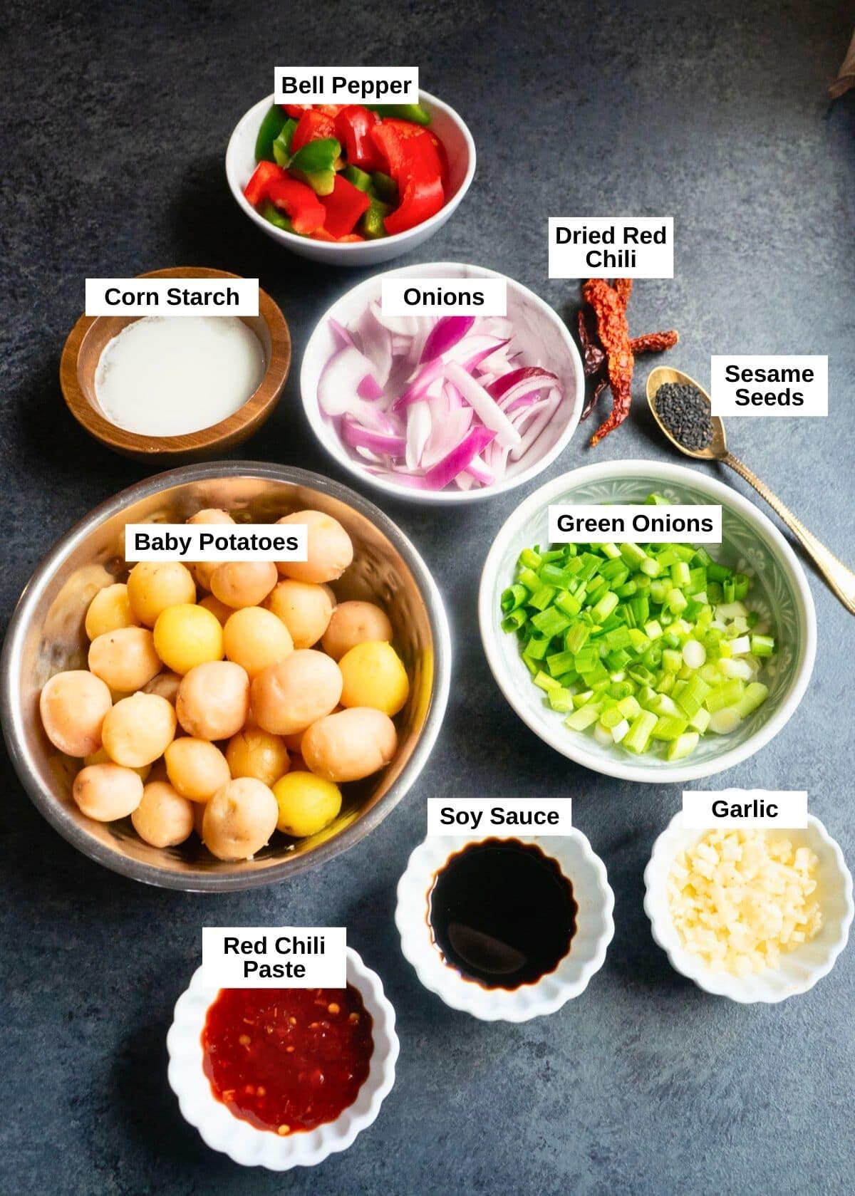 Flavorful and easy Garlic Chili Potatoes, made with steamed potatoes, garlic, chili sauce and honey, sprinkled with green onions and sesame seeds. Enjoy them as an appetizer or side! Garlic chili potatoes ingredients