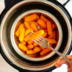 Cooked instant pot steam carrots on a fork