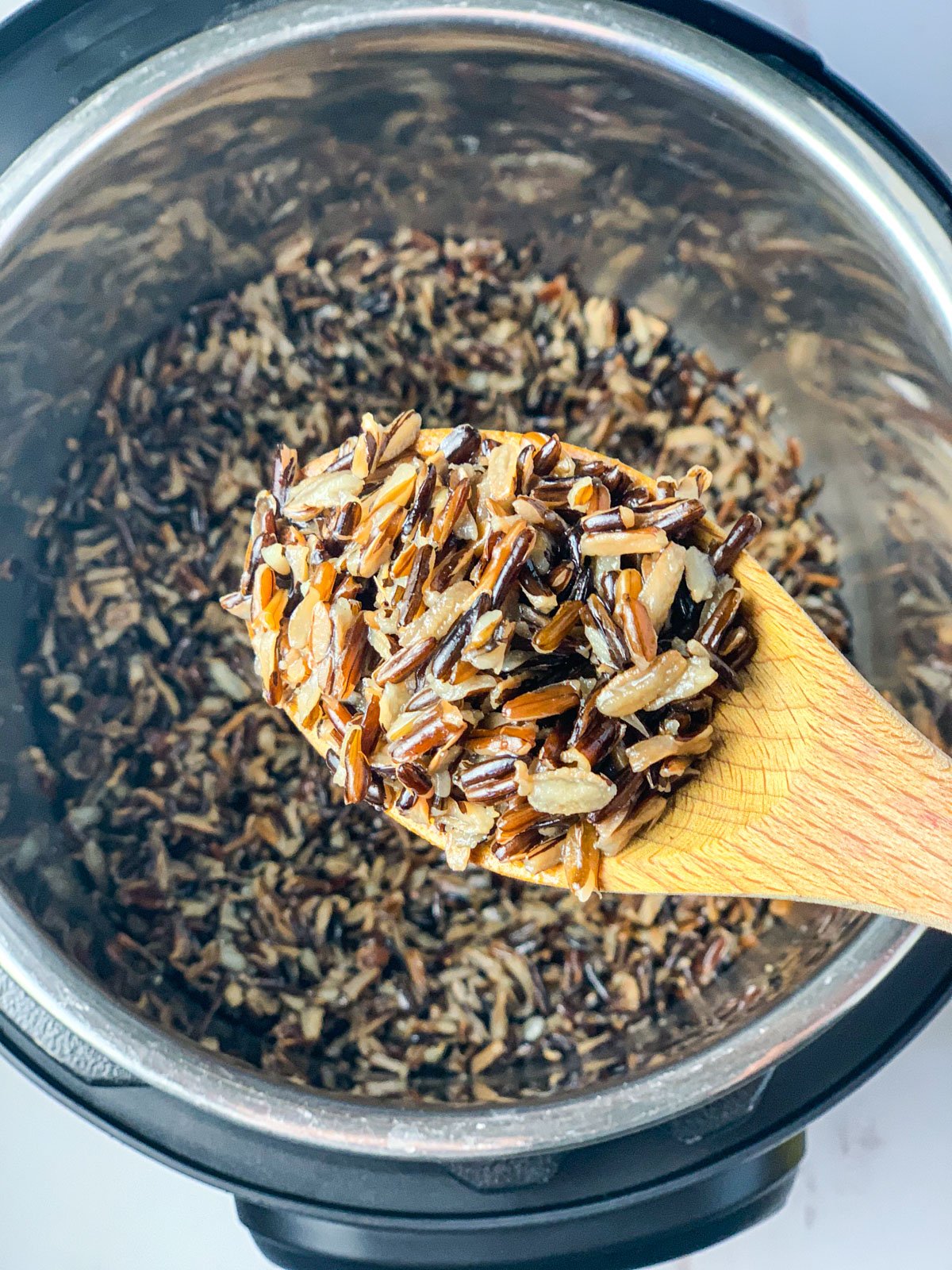 Wild rice on a ladle cooked using instant pot