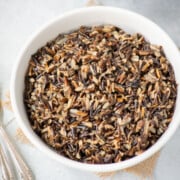 Cooked instant pot wild rice in a white bowl