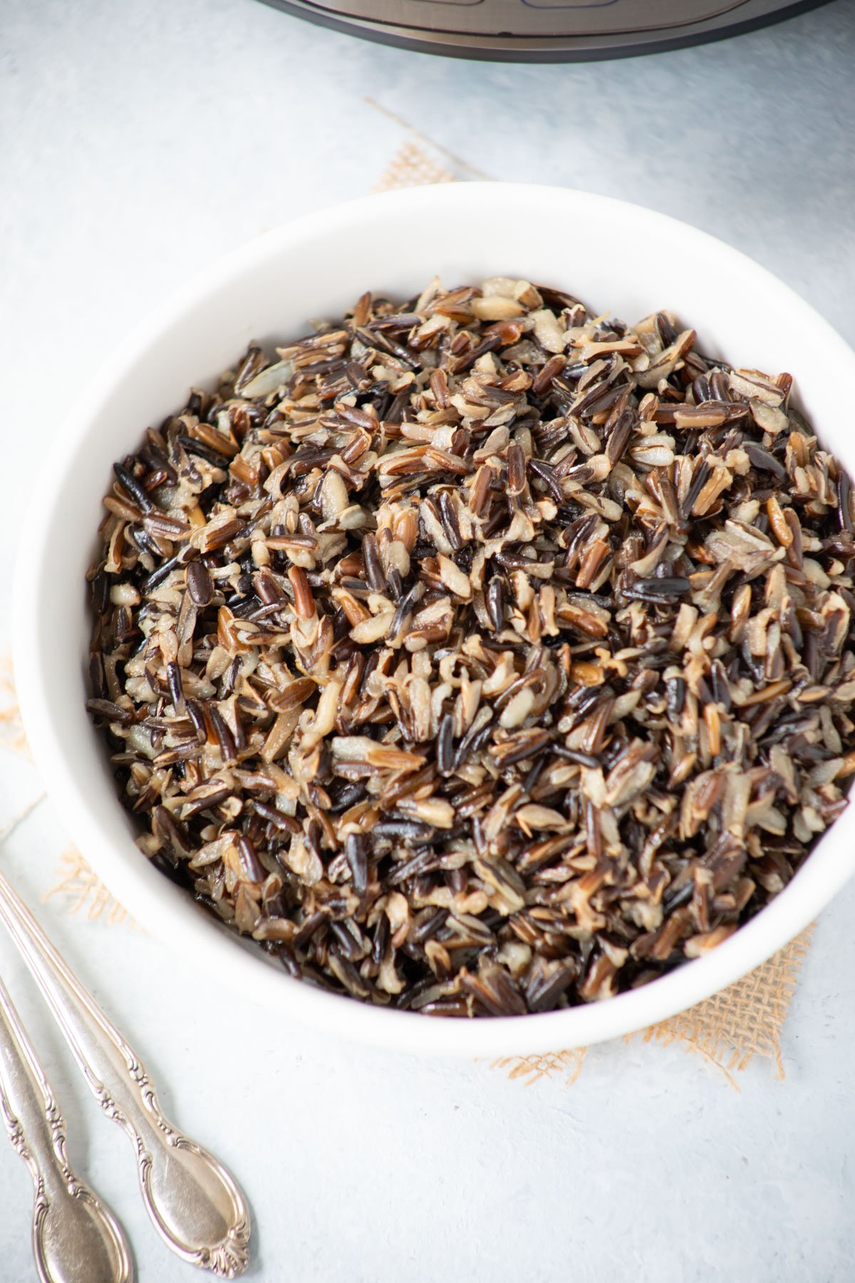 Perfectly cooked wild rice in a white bowl