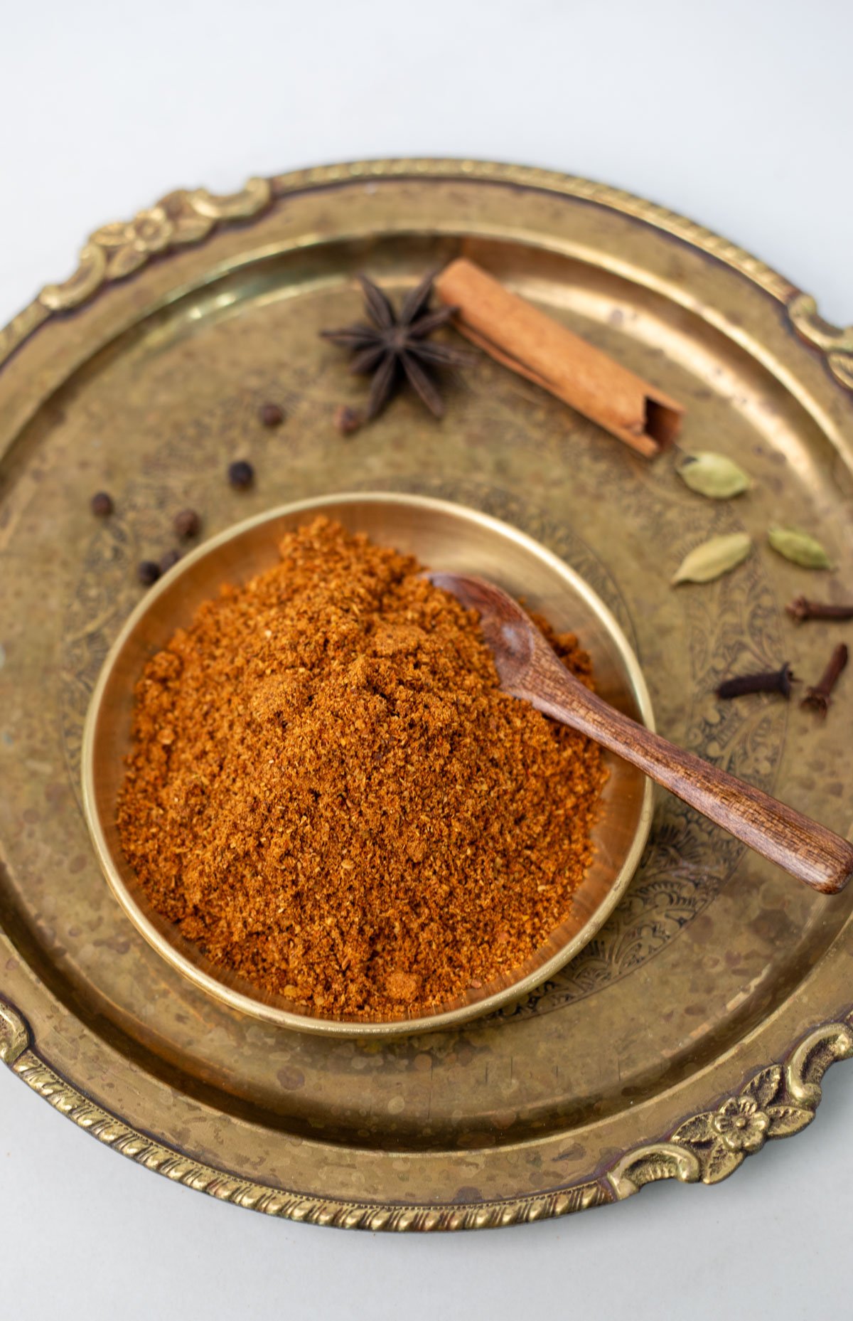 A bowl of Chettinad Masala with wooden teaspoon