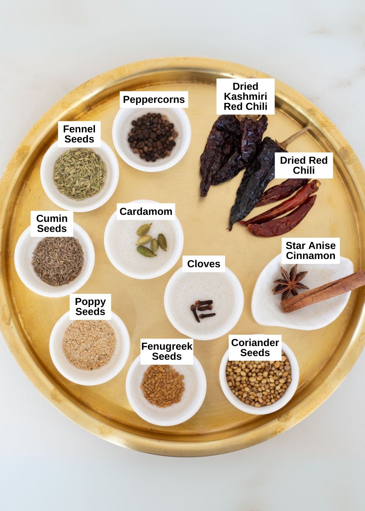 Chettinad Masala ingredients on a brass plate