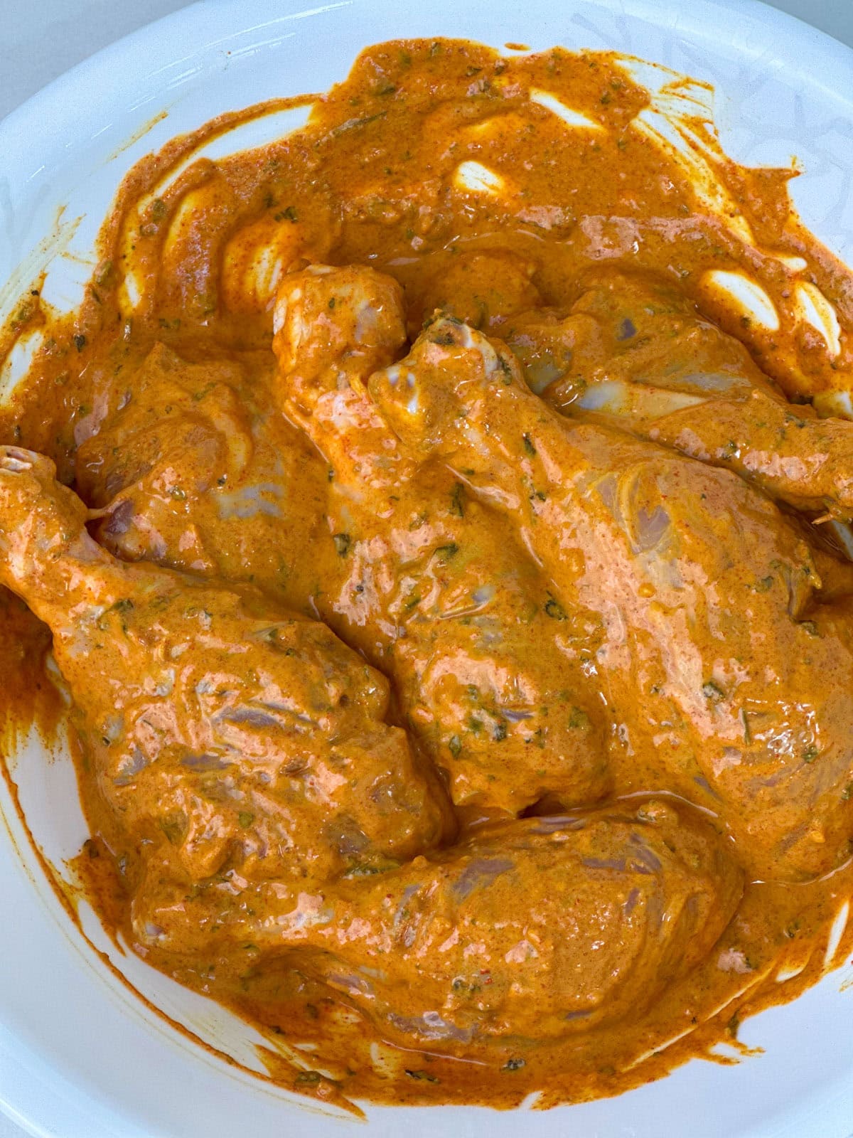 A flavor packed spicy dish from the Indian subcontinent popular all over the world - Tandoori Chicken. Chicken is marinated in yogurt, ginger, garlic, spices and lemon juice, then grilled in the air fryer or oven. marinate chicken legs to cook tandoori chicken