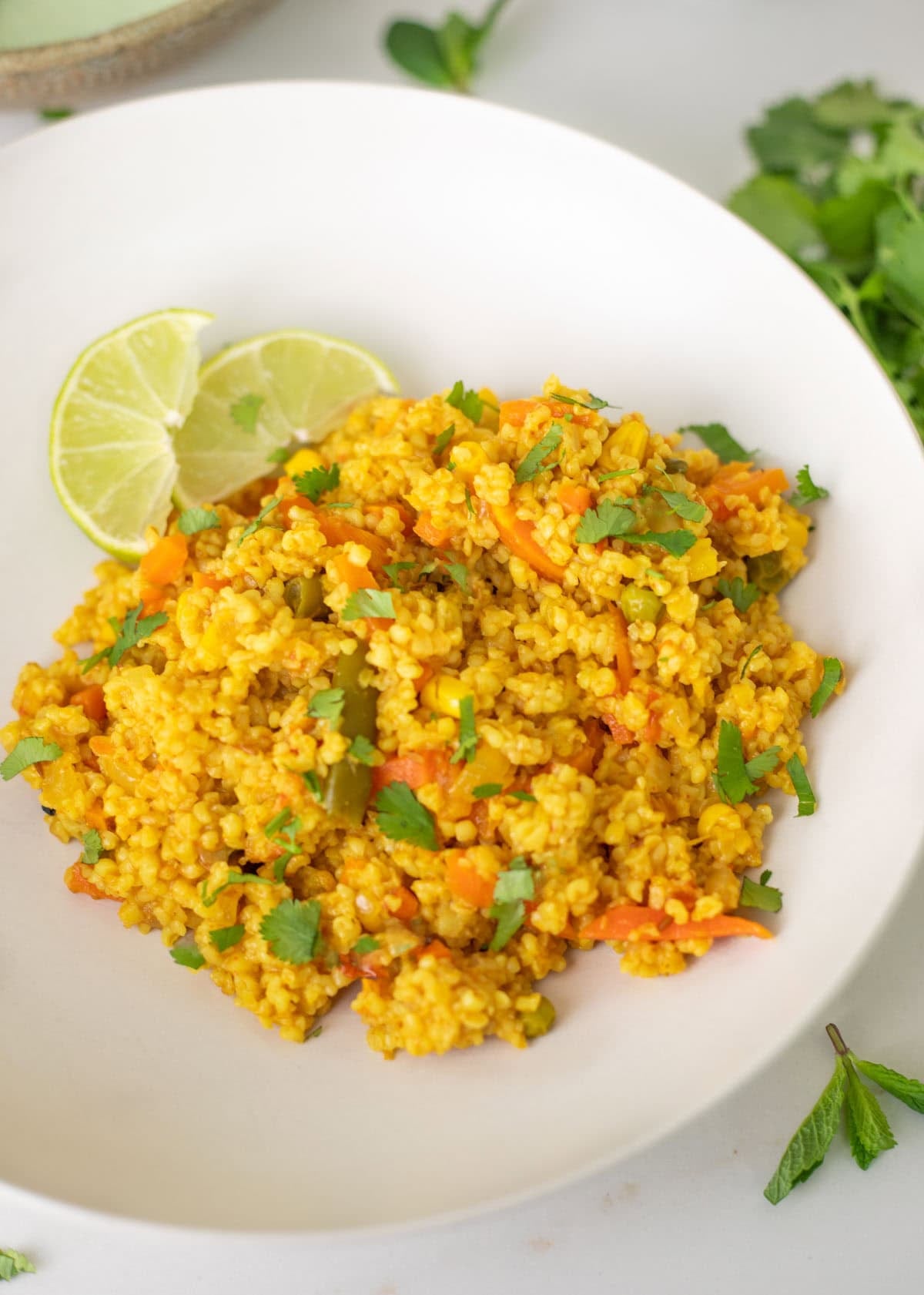dalia pulao on a white plate ready to serve
