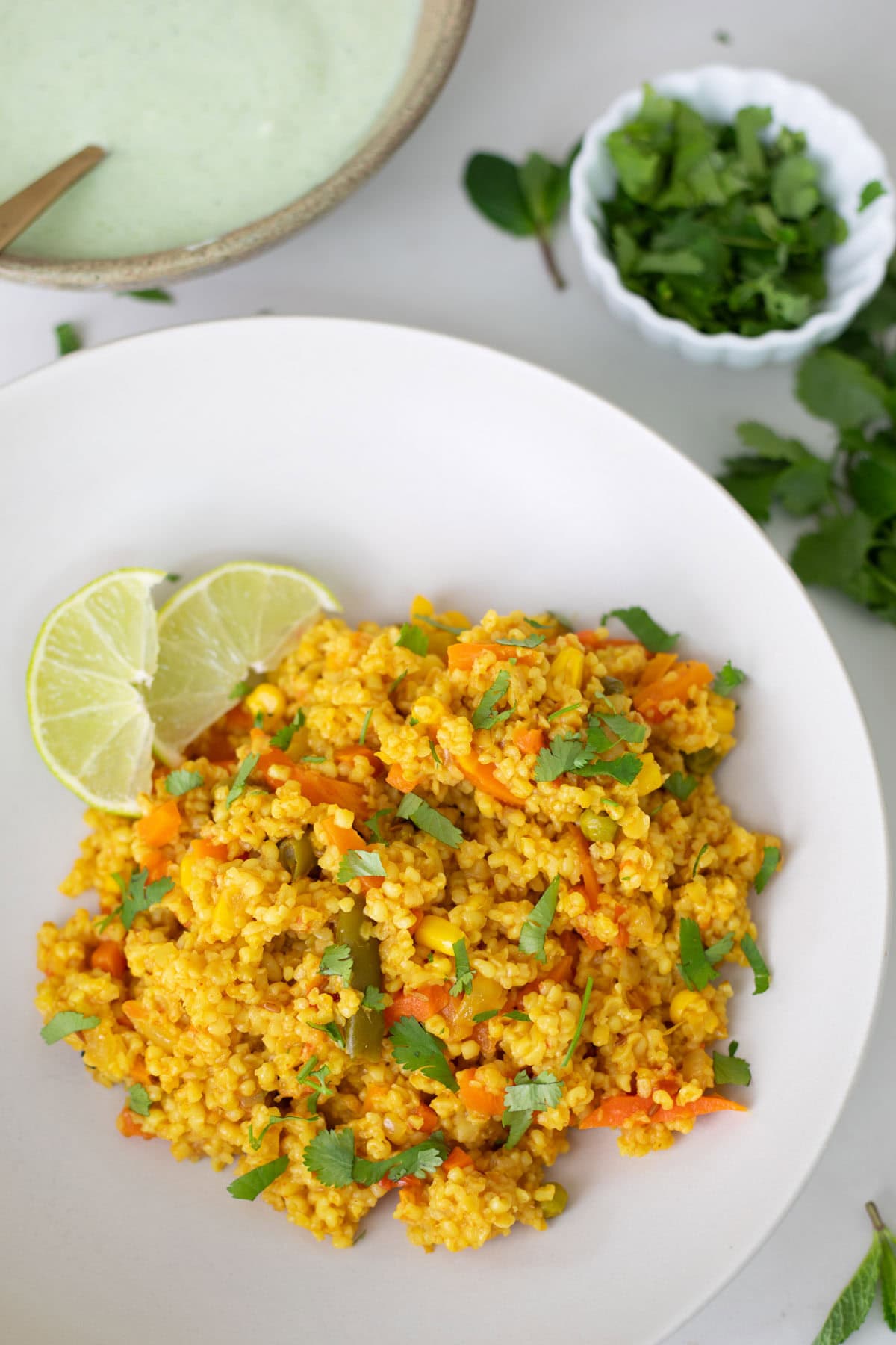 vertical shot of dalia pulao on a white plate