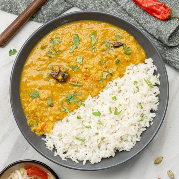 top view of masoor dal with rice on a plate