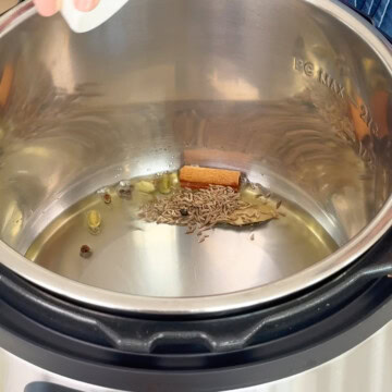 saute whole spices and cumin seed in the instant pot to cook quinoa pulao