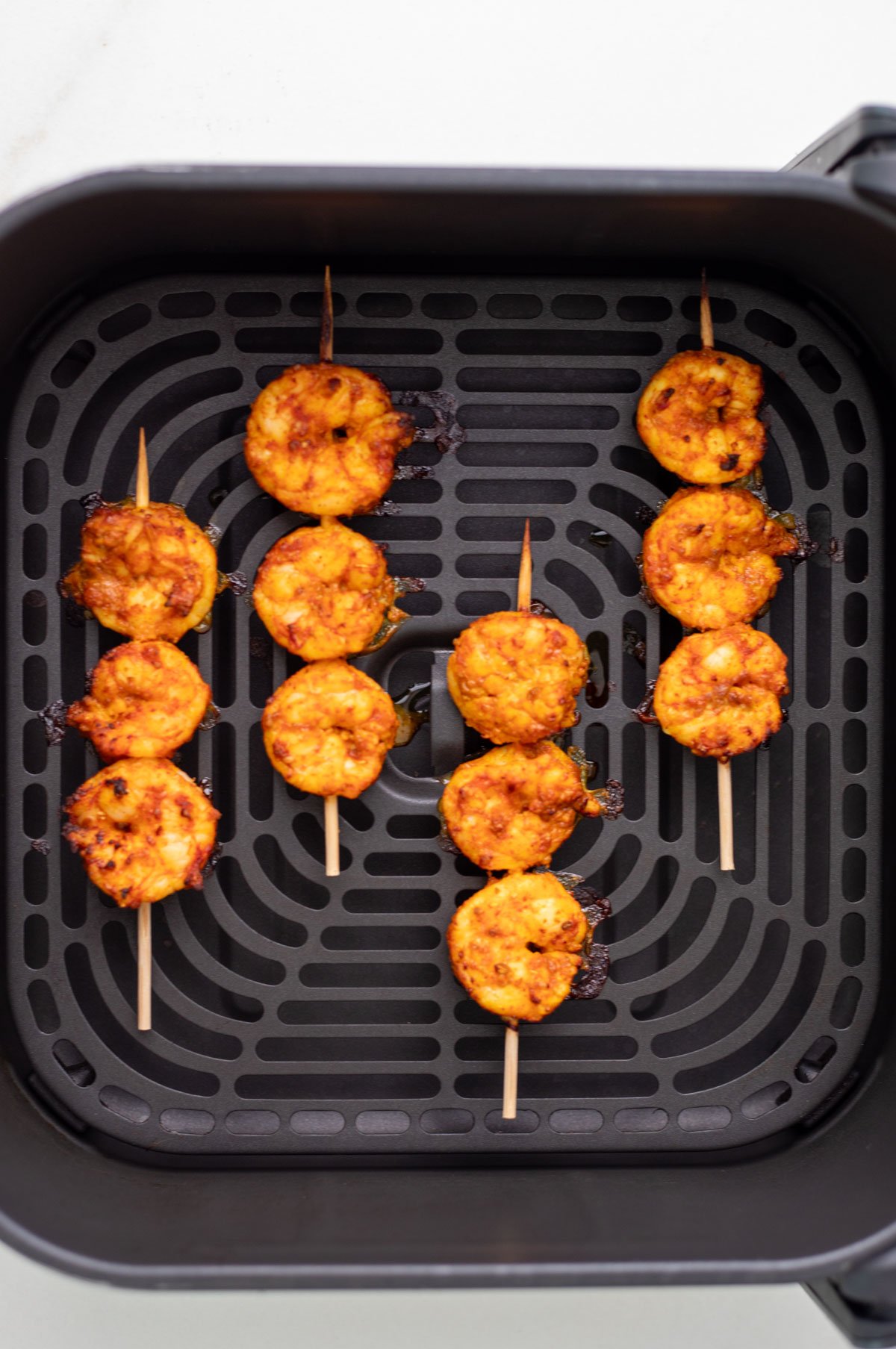 Tandoori shrimp in air fryer basket
