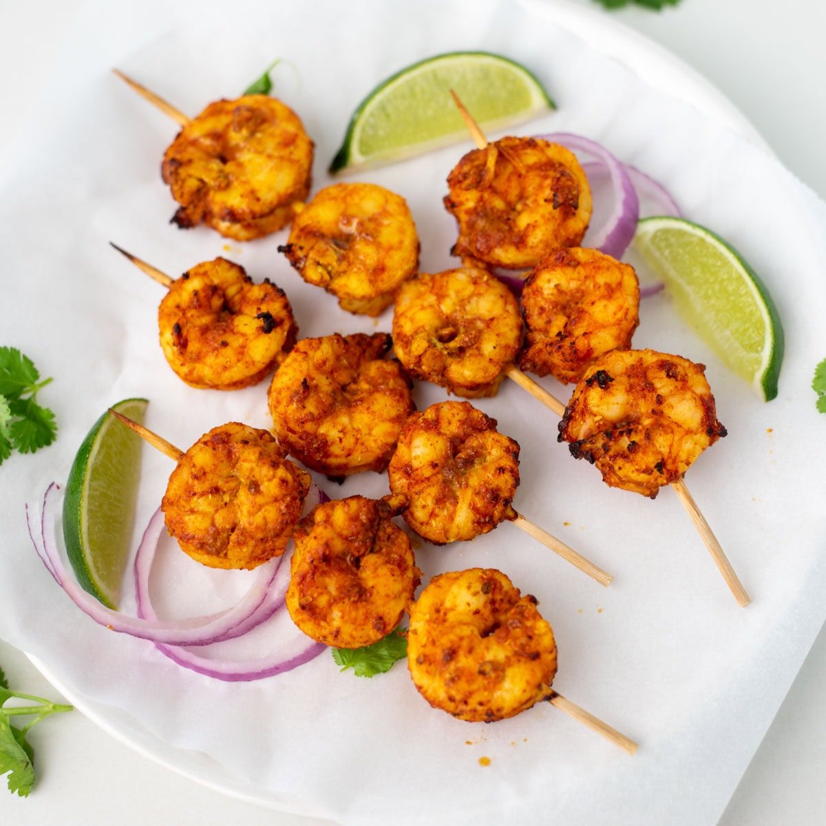 closeup shot of tandoori shrimp in skewers