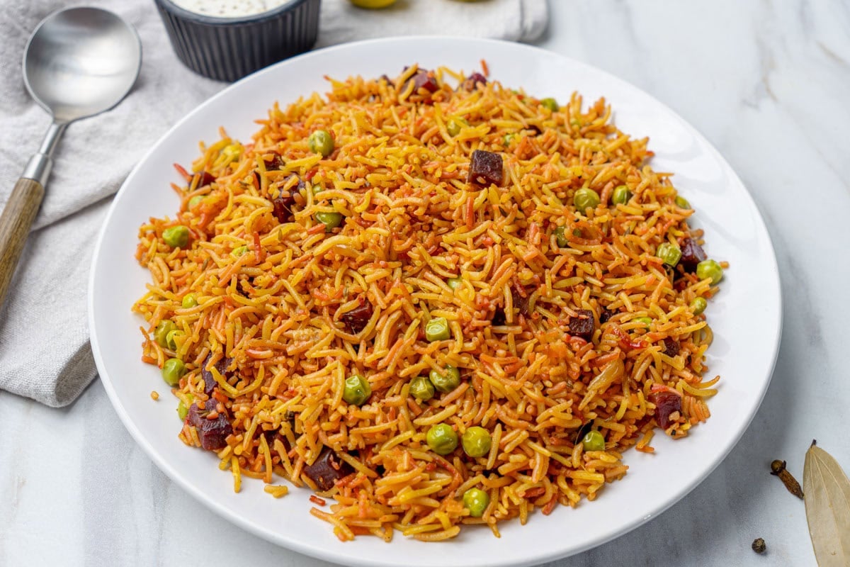 ready to serve beetroot rice on a white plate