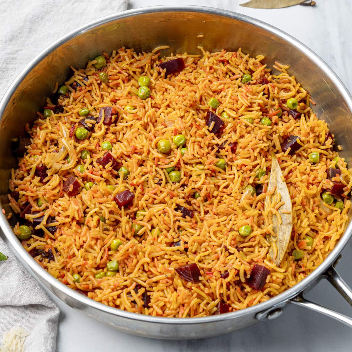Beet pulao in a stainless steel pan