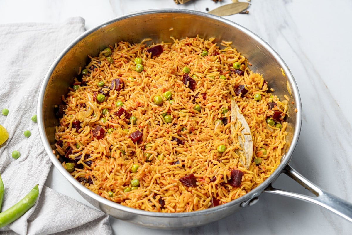 beetroot rice pulao in a steel pan