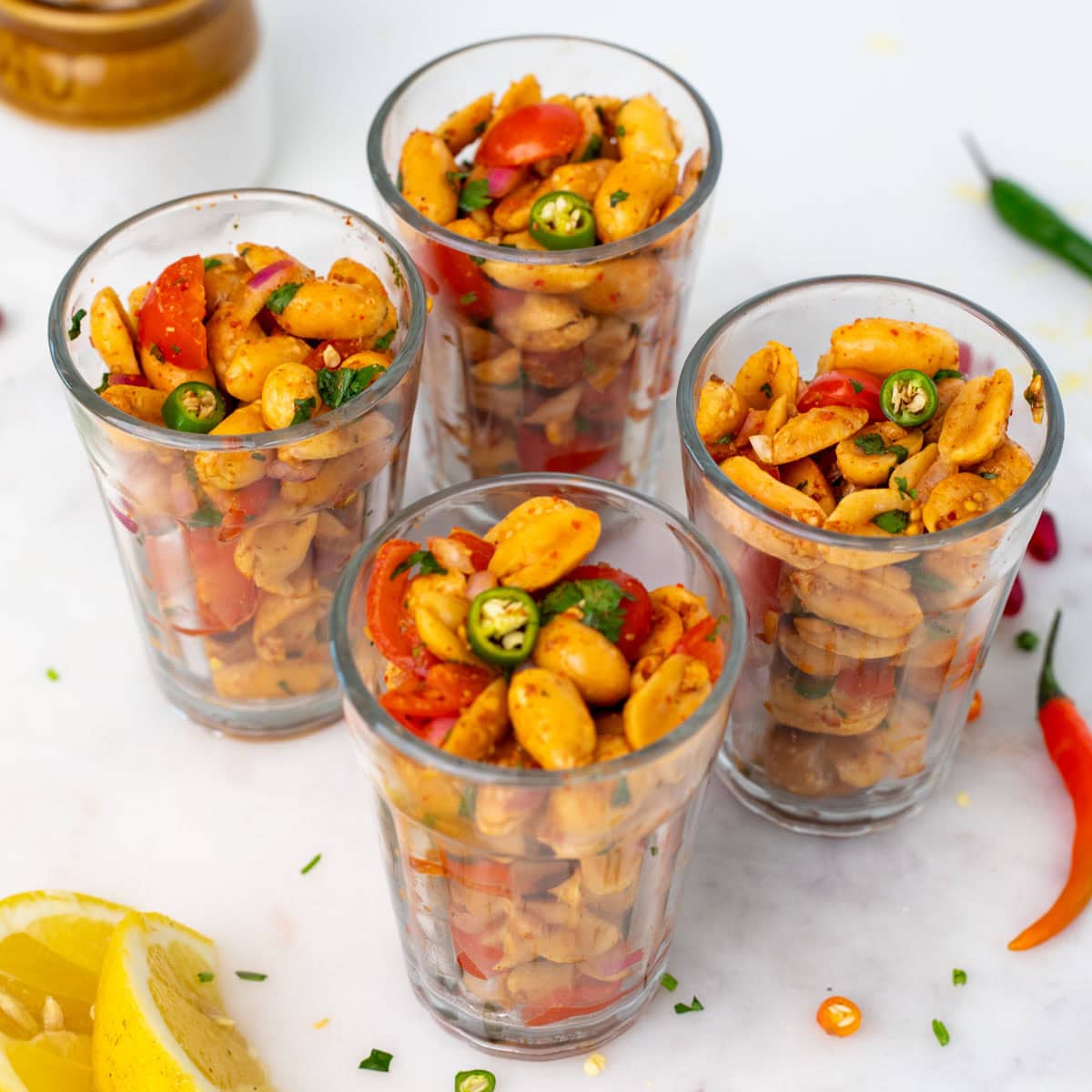 Four glasses filled with peanut chaat