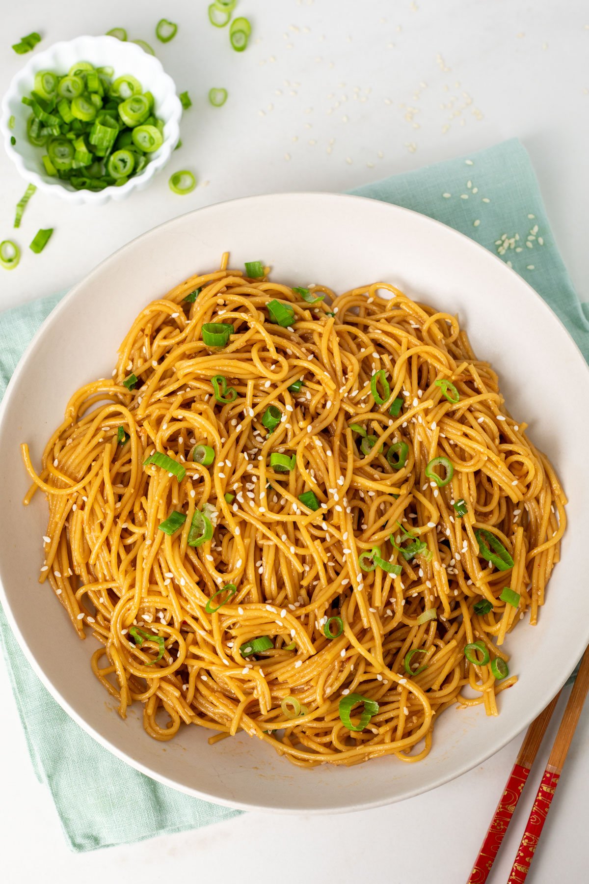 top view of garlic noodles on a white plate
