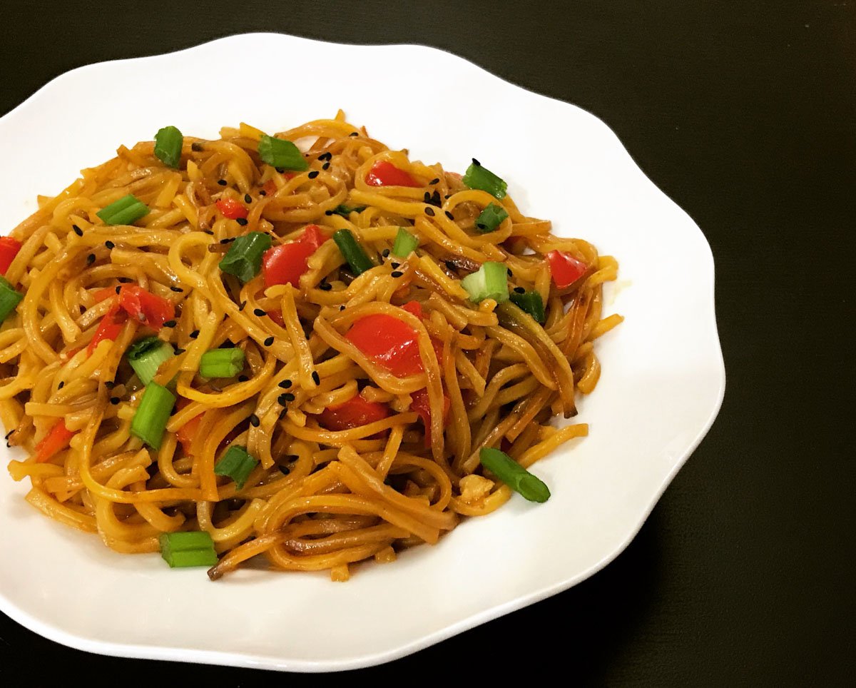 Ready to serve Garlic noodles on a white plate