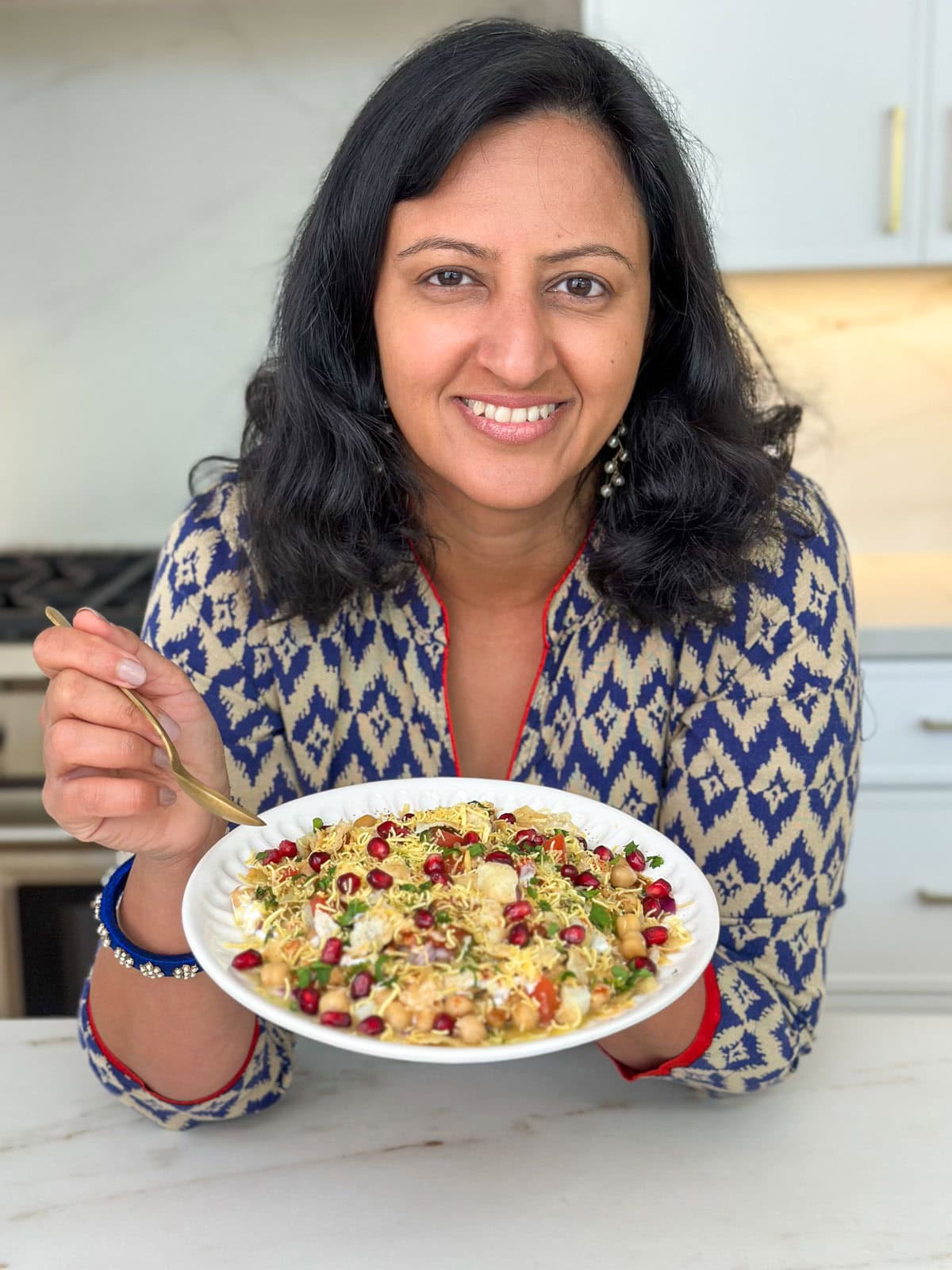 Meeta holding a plate of Chana Chaat.