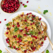Chana Chaat garnished with cilantro and pomegranate seeds