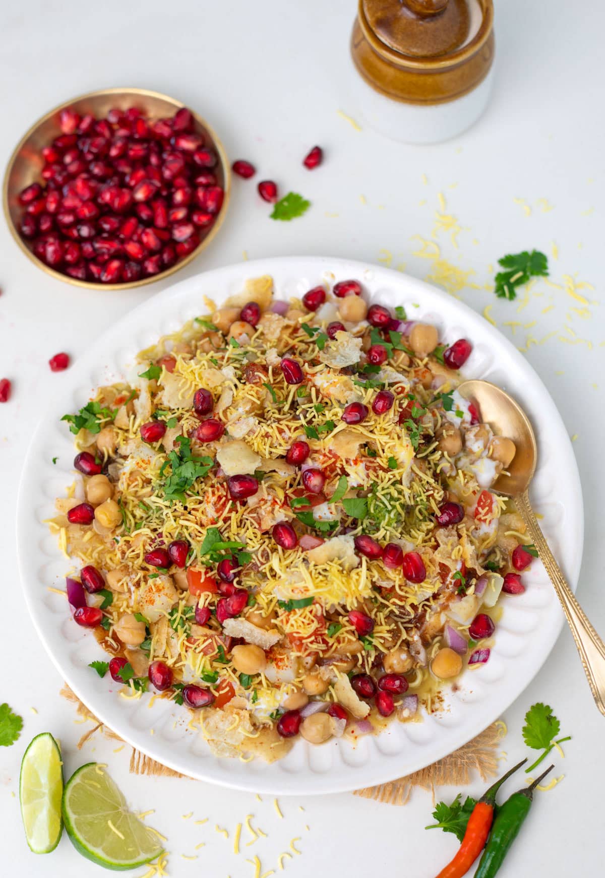 Chana Chaat garnished with cilantro and pomegranate seeds