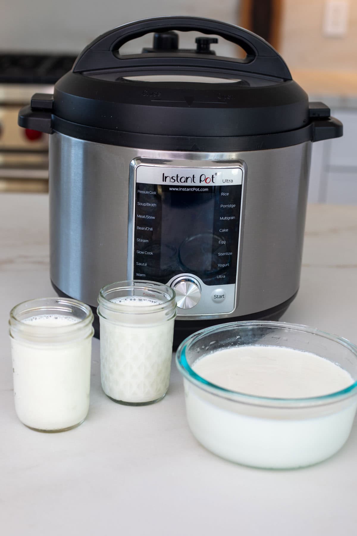 Instant pot yogurt set in a bowl and jars.