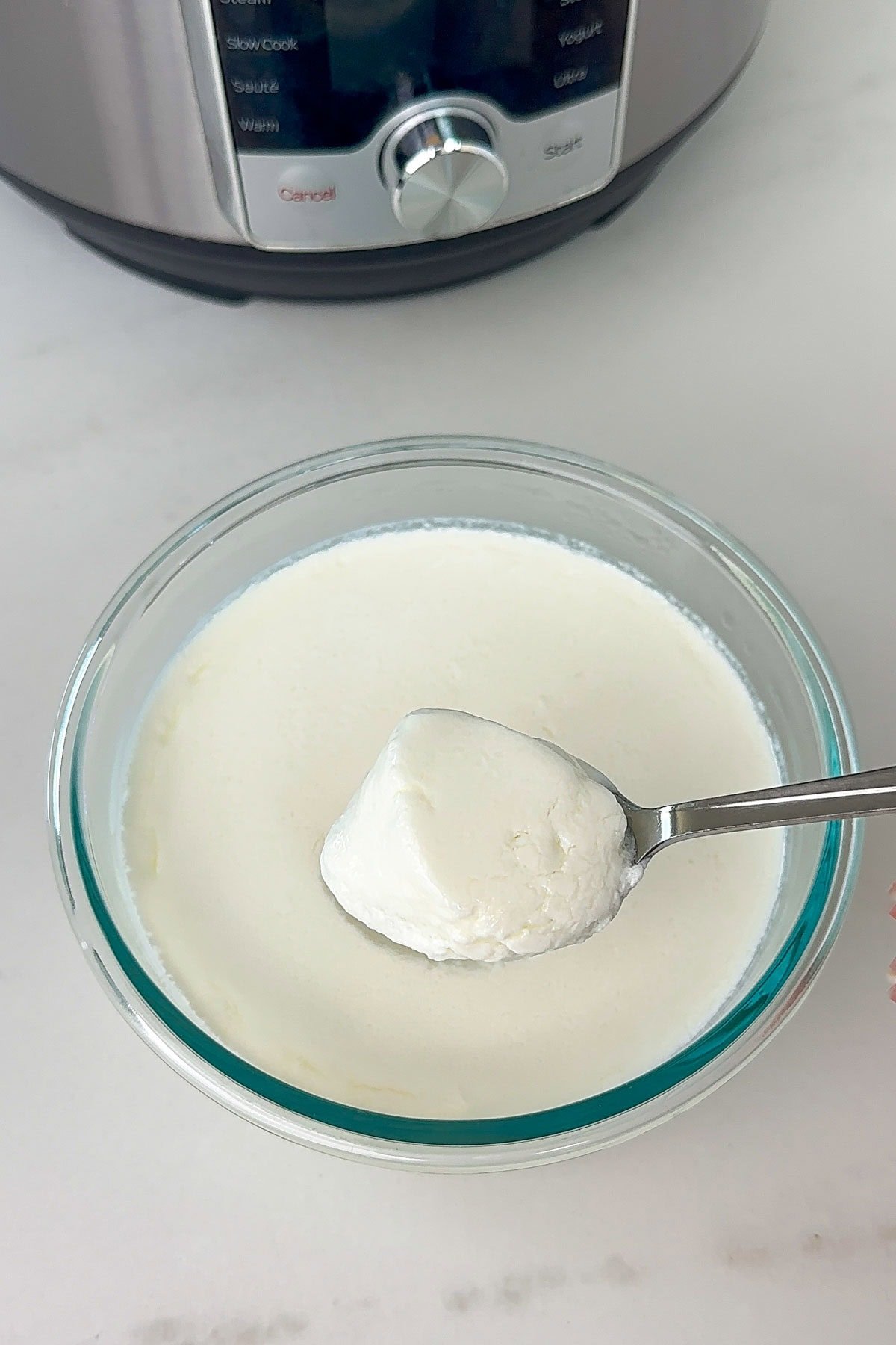 Instant pot yogurt in a glass bowl.