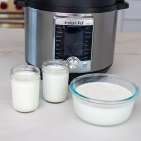 Instant pot yogurt set in a bowl and jars.