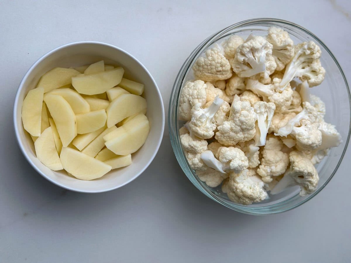 Potato and cauliflower in a bowl for aloo gobi recipe