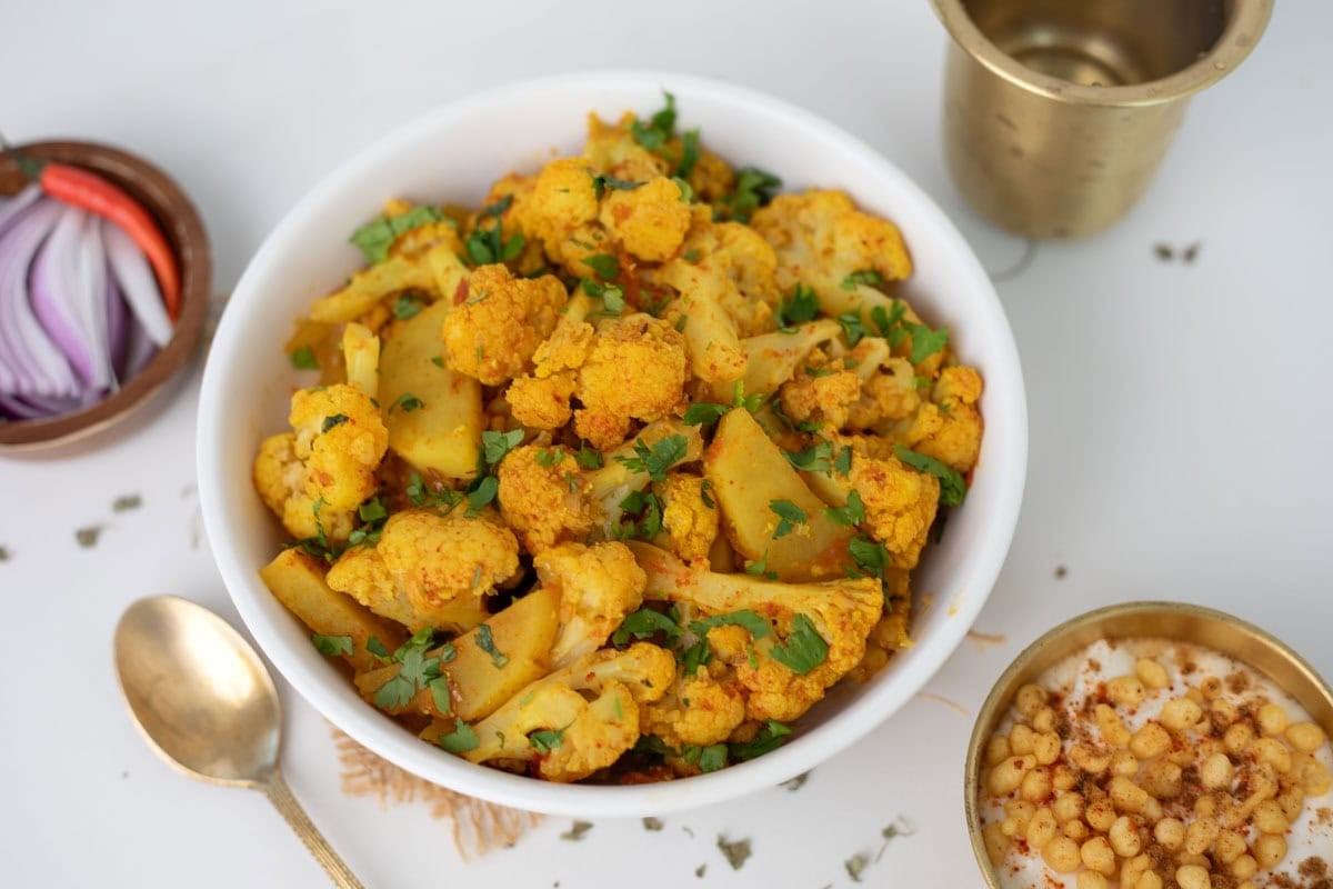 Aloo gobi garnished with cilantro in a bowl