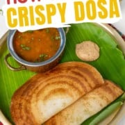 Crispy dosa on a plate with banana leaf