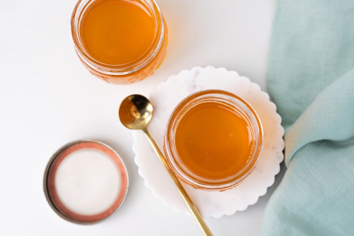 Top view of jars filled with ghee on a table.