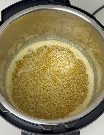 bubbling melted butter in instant pot for ghee recipe