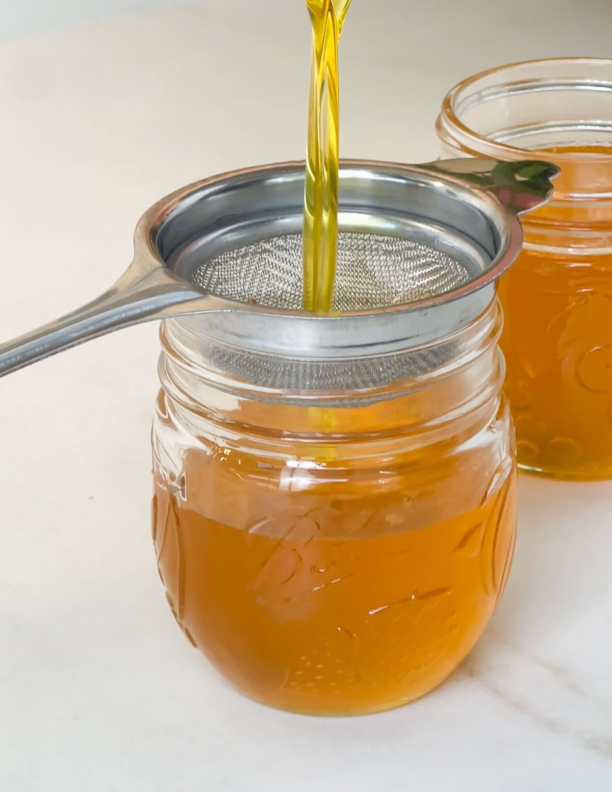 Strain ghee using mesh strainer